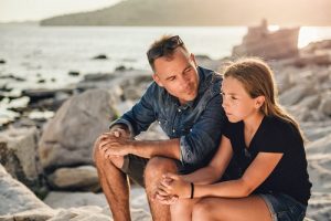 father looks for signs of anxiety in teenagers