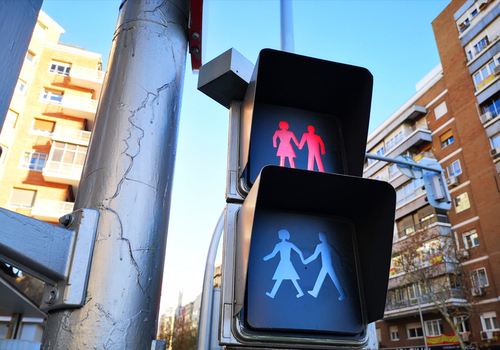 Traffic light in Madrid, Spain, with icon of a couple with red color, like a broken love or difficulty relationship