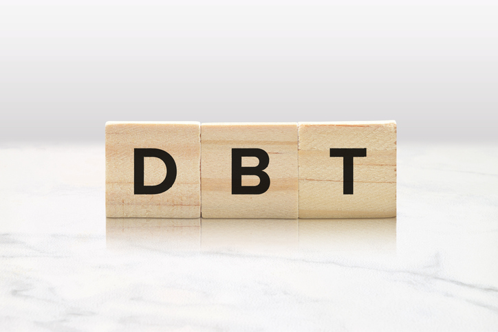DBT on Wooden Blocks – Dialectical Behavior Therapy Mental Health Concept